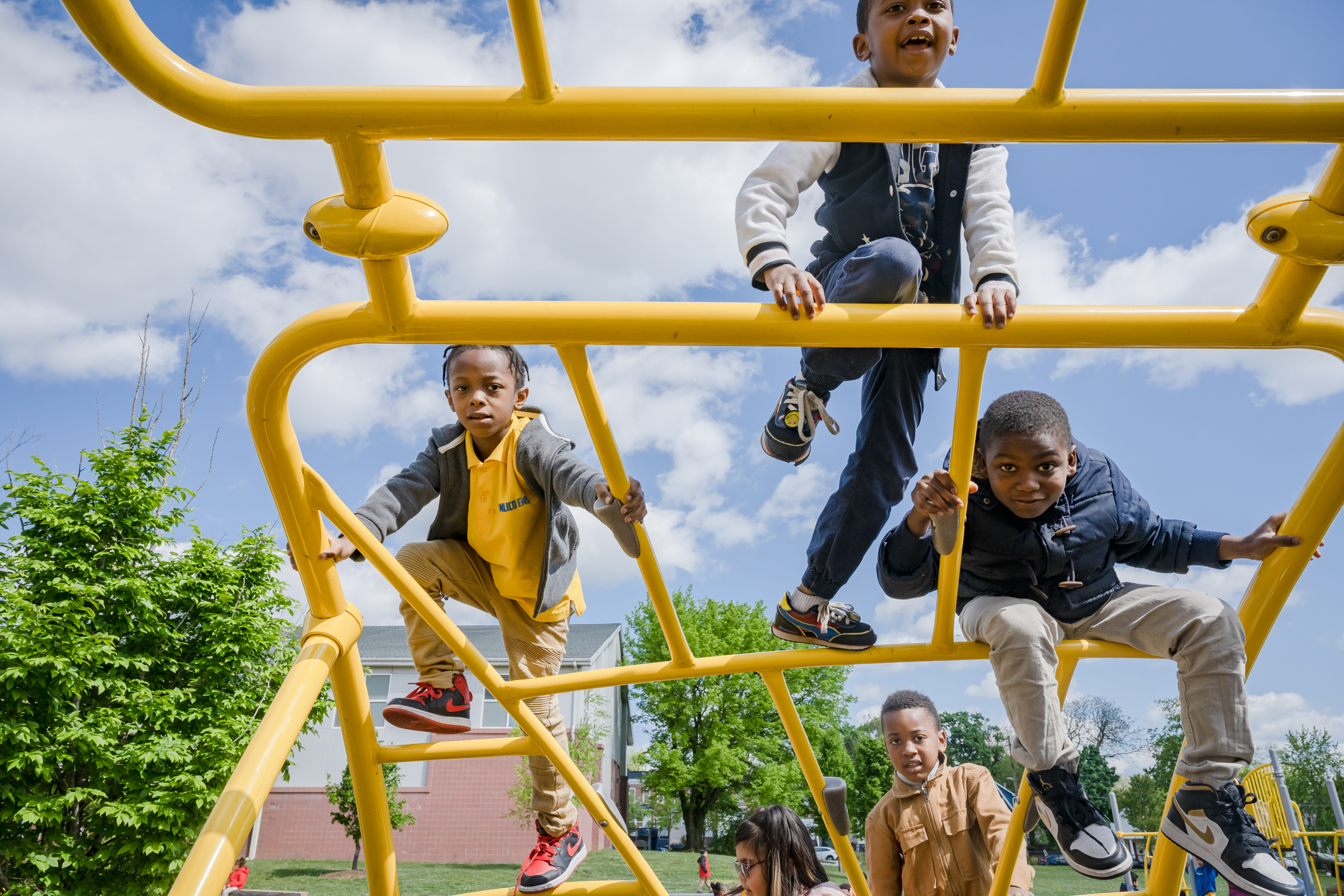 children playing on jungle gym